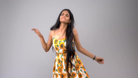 Happy Indian girl dancing and enjoying