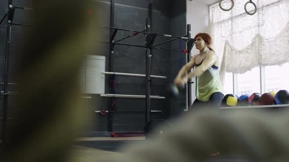 Sportswoman Doing Kettlebell Swing