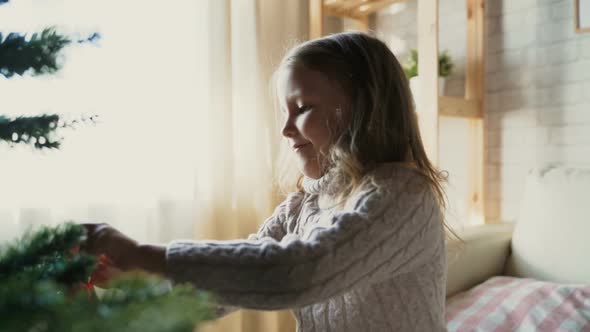 Child Together With Pregnant Woman Mother Dress Up Christmas Tree