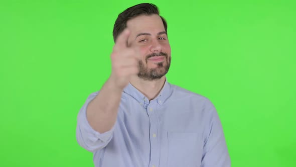 Portrait of Man Pointing at the Camera Green Screen