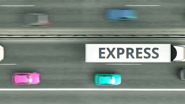 Semitrailer Trucks with EXPRESS Text Driving Along the Highway