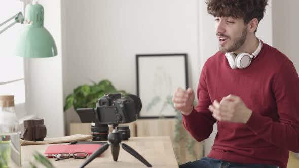 Male Creative Vlogger Recording Video Content About New Photography Trends