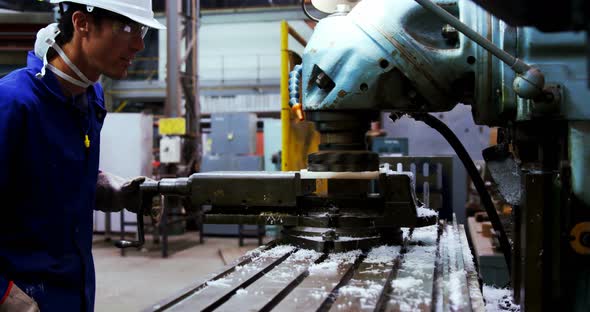 Male engineer working on a machine 4k alt