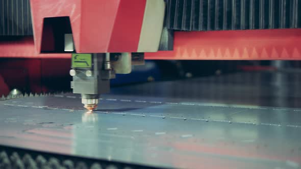 Incisions Are Being Made on a Metal Sheet By a Laser