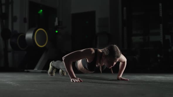 Athletic Female Fighter in Gym Strong Woman Performs Explosive Push Ups Clapping Push in Slow Motion