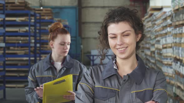 Beautiful Cheerful Female Factory Worker Smiling To the Camera