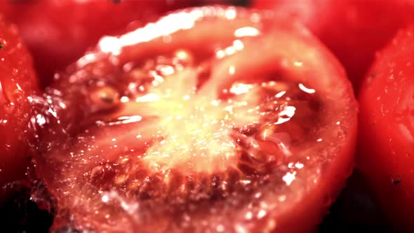 Super Slow Motion on a Piece of Tomato Drop Drops of Water