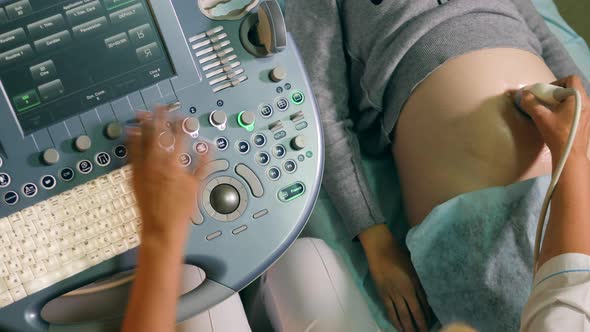 Ultrasonic Procedure Held on a Woman with Medical Equipment