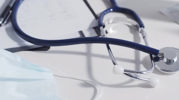 Close-up of different stuff and equipment on doctor's table in medical office in hospital.