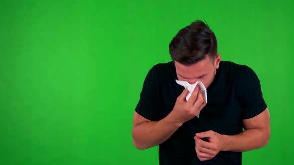 Young Handsome Caucasian Man Blow One's Nose - Green Screen - Studio