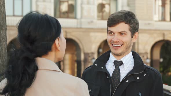 The Smiling Man Has a Nice Conversation with a Woman