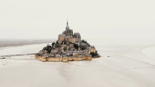 Drone Descending Right Near Mont Saint Michel, Iconic Island Fortress Town, Famous Historic Landmark