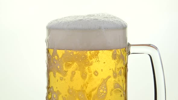 Pouring Lager Beer in A Glass Mug