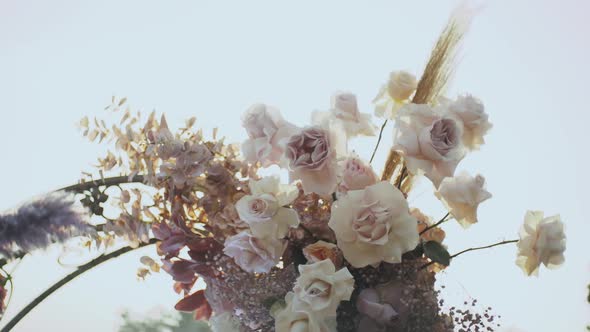 Close Up View of Wedding Floral Decorations Arch of Flowers in Pastel Faded Colors Slow Motion