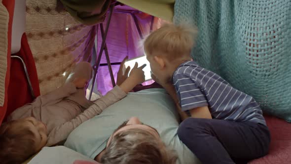 Playful Kids Using Tablet with Father