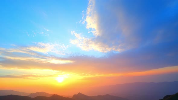 4K : Colorful of clouds above mountain during sunset.