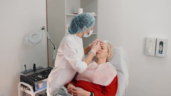 Mesotherapy of a Woman's Face in a Beauty Salon