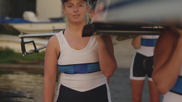 Female rowing team training on a river