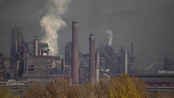 Air pollution over the city by emissions from industrial chimneys