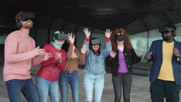 Young multiracial friends having simulation experience with futuristic virtual reality glasses