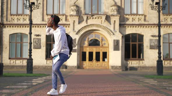 Joyful Confident African American Student Dancing in Slow Motion at University Campus on Sunny