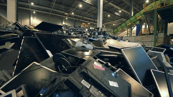 Discarded Computer Monitors in an Indoors Dumpsite