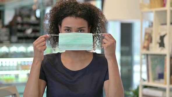 Portrait of Young African Woman Wearing Face Mask 