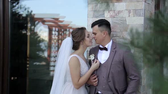 A loving couple walks around the city on their wedding day