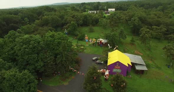 Low altitude, orbiting aerial views of an eccentric’s collection of giant American roadside attracti