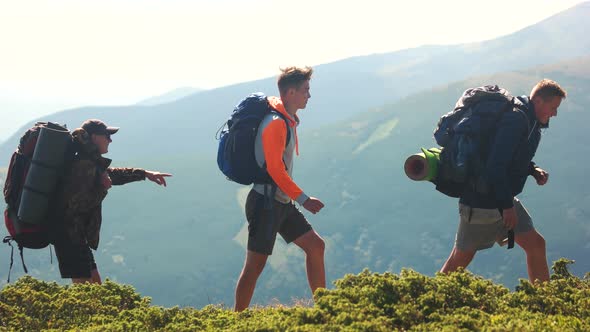 Three Friends Hiking in Mountains