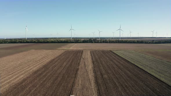 Top view of moving tractor with plow