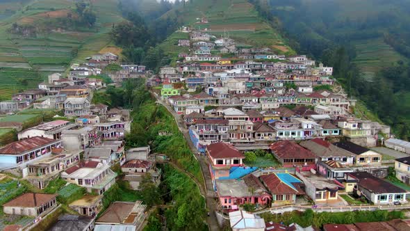 Tropical village simple houses on Mount Sumbing volcano slope, Java, aerial