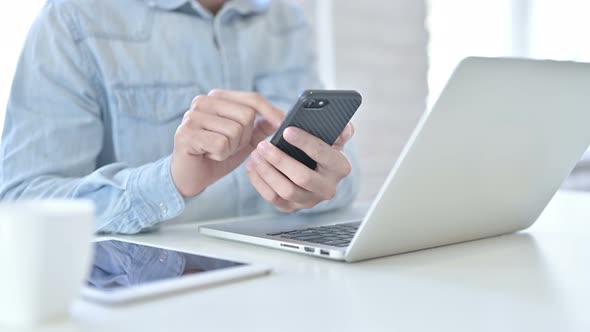 Close Up of Young Guy Hands Using Smartphone