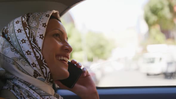 Young woman wearing hijab out and about in the city