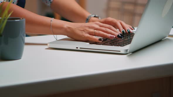 Close Up of Woman Hands Typing on Laptop