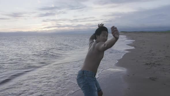 Dancer doing jump, dancing on the beach