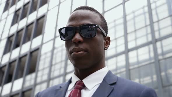 Success, Challenge, Leadership- Black Business Man with Sunglasses in The City