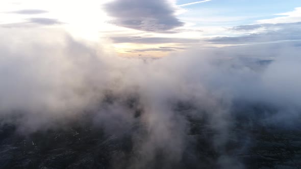 Aerial of Mountain Top Surrounded by Clouds 03