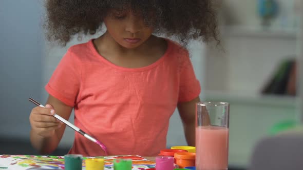 Curly Black-Haired Girl Painting With Watercolors at Art School, Art Hobby