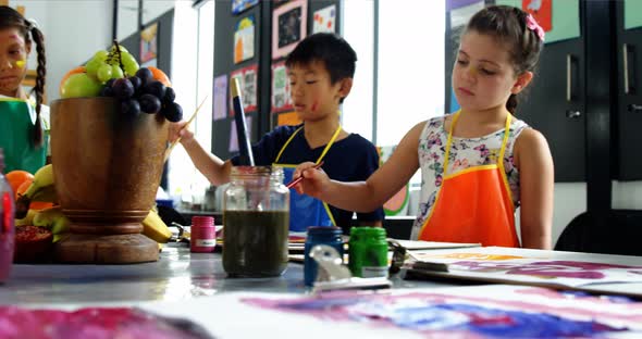 Attentive schoolkid practicing drawing