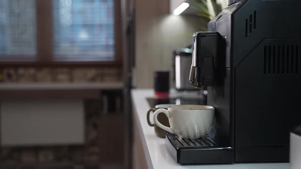 Girl Adds Milk to Coffee and Leaves to Drink It