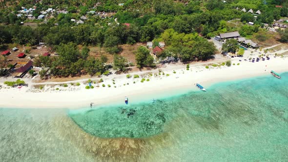 Aerial tourism of luxury coast beach voyage by blue ocean and white sandy background of a dayout nea