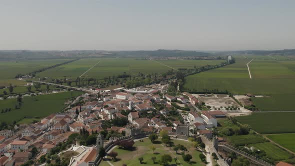 Strategically built Montemor-o-Velho castle on hilltop, Portugal; aerial