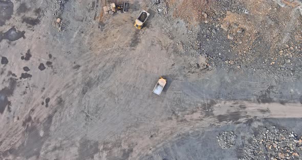 Excavator Loading Granite Stones in a Quarry
