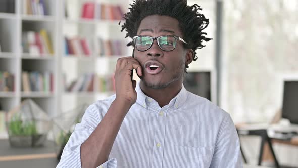 African Man Talking on Smartphone