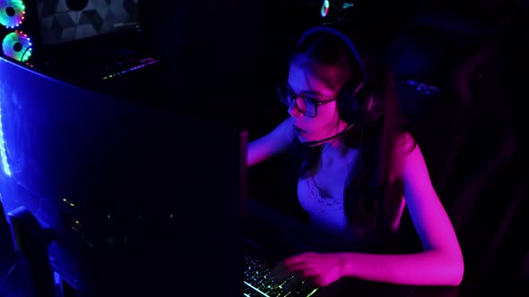 Young Sexy Woman Playing a Game in Gaming Club