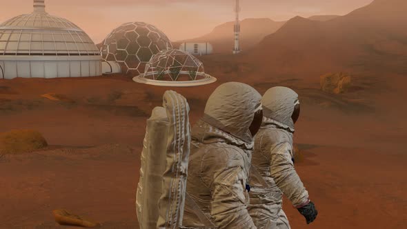 Two Astronauts Walking On The Surface Of Mars