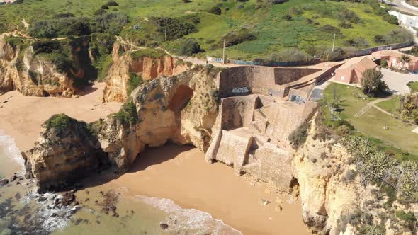 Stone staircase in Pinhão Beach within secluded scenery in Lagos, Algarve Portugal