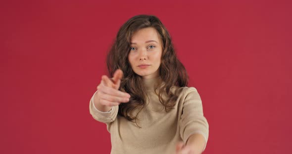 Beautiful Caucasian Young Woman Showing Inviting Gesture with Hands