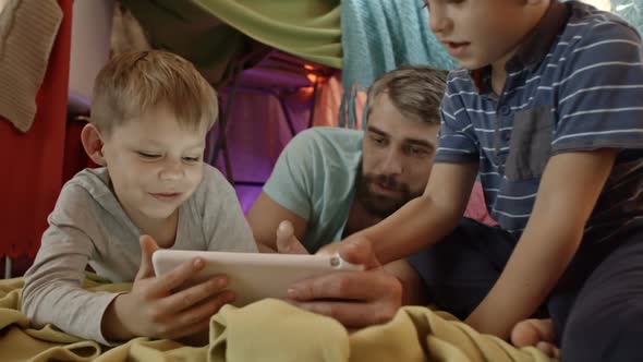 Boys Playing on Table with Dad alt